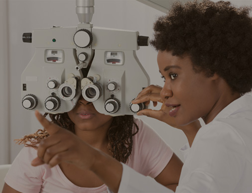 Optometrist checking a patient's vision with a machine