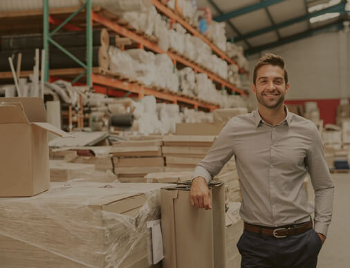 Man standing in warehouse.